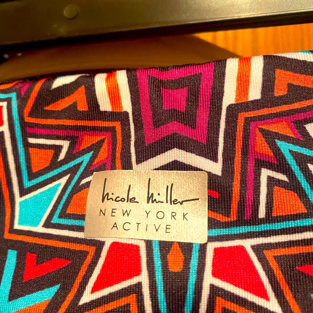 Brand Nicole Miller active wear. These leggings are spandex & polyester. Medium